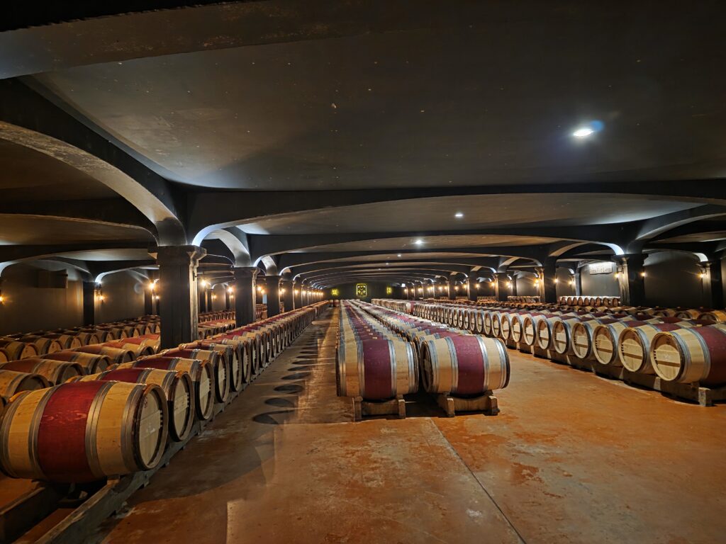 one-of-the-propertys-grand-cellar-rooms-rows-of-barrels-disappearing-into-the-distance